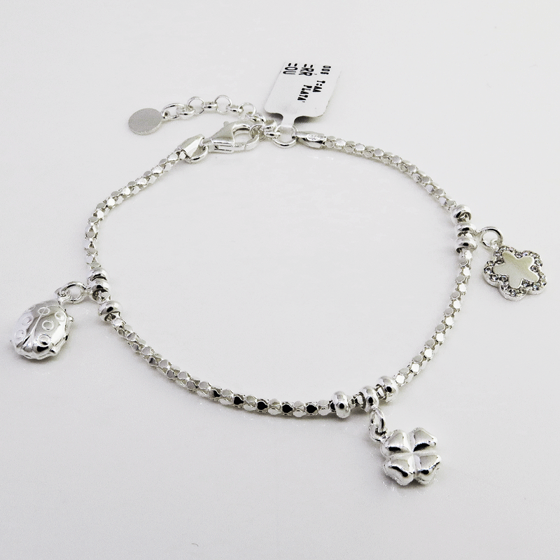 Pulsera fope 3 dijes , vaquita, trebol y flor con piedras