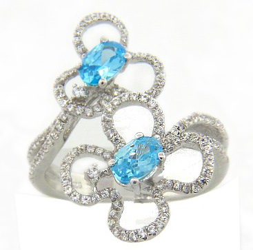Anillo micro pave dos flores piedra celeste