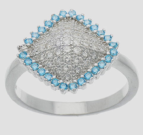 anillo rombo pavee con piedras blancas en el centro y piedras celestes alrededor