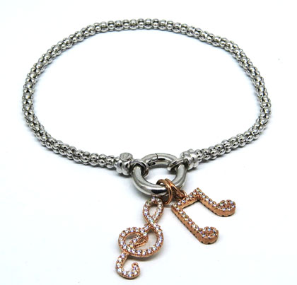 pulsera fope fina con dijes notas musicales rosadas con piedras