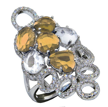 anillo alargado piedras champagne y circulos calados con piedras blancas