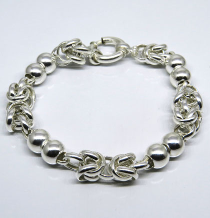 pulsera eslabones curvos entrelazados y bolitas
