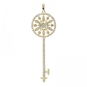 Dije linea premium, llave amarilla de piedras blancas