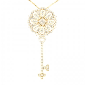 Conjunto linea premium, llave de 6,5 cm, amarilla, calada, con piedras 