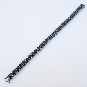 Pulsera tenis piedras negras y rodio negro. Diametro piedras prox: 6 mm