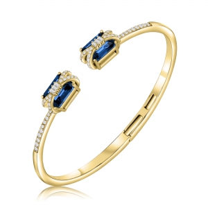 Esclava amarilla abierta, con piedras baguettes azules en las puntas