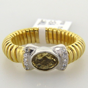 anillo resorte simple con cubic central  champang  y pave enchapado amarillo