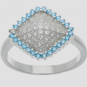 anillo rombo pavee con piedras blancas en el centro y piedras celestes alrededor